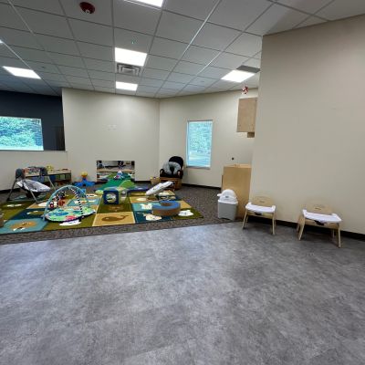 Playmats and interactive toys are available in the infant room at the Foundations Community Childcare Center